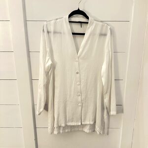 STELLA CARAKASI M White button V neck woman wardrobe staple quiet luxury blouse